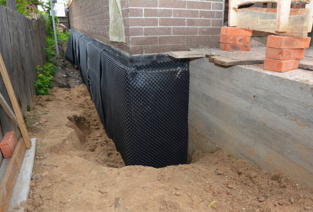 SJ Waterproofing Pros technician performing targeted Foundation Crack Repair assessment in Monroe, MI